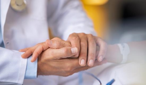 An image of hands cradled in comfort to illustrate an article about palliative care