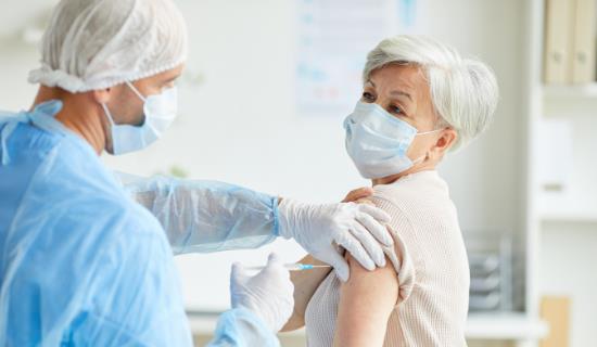 older woman receives vaccine
