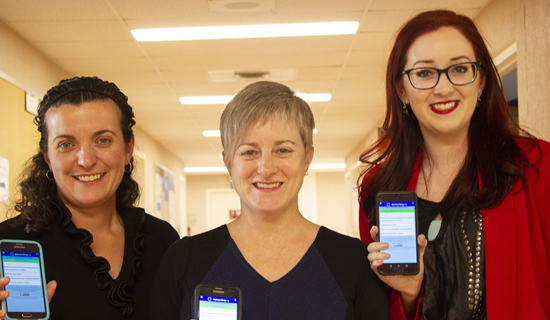 Three women are holding cell phones with the deprescribing app on screen