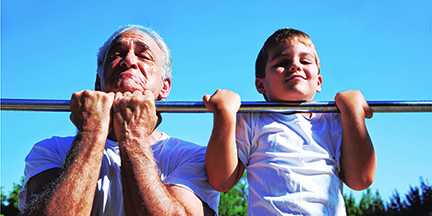 A senior and a child exercising together