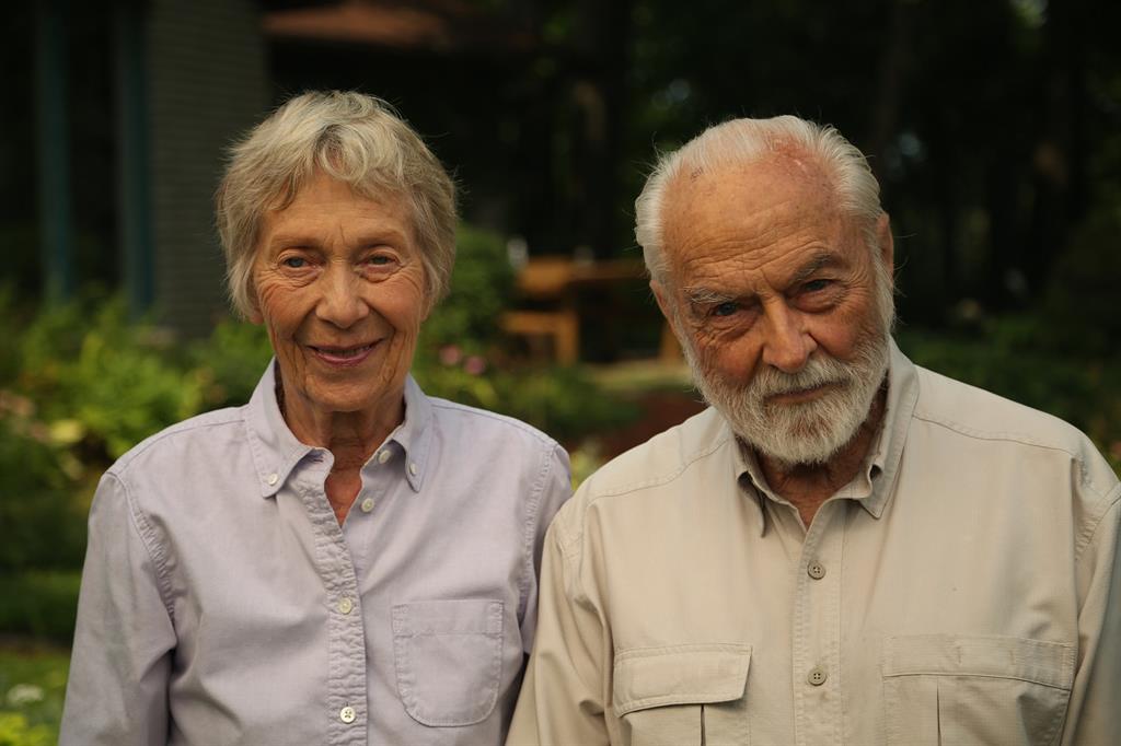 Dr. Hugh Lafave and his wife Joanne sitting outdoors smiling