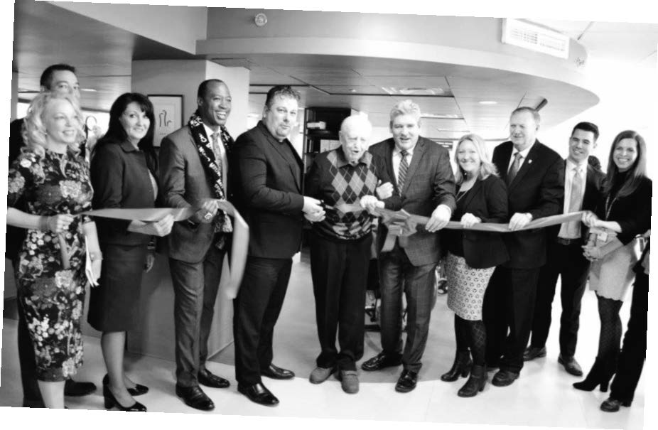 Group picture of ribbon cutting of the new John and Jennifer Ruddy Geriatric Day Hospital