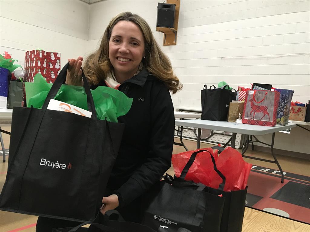 a woman holding a gift bag