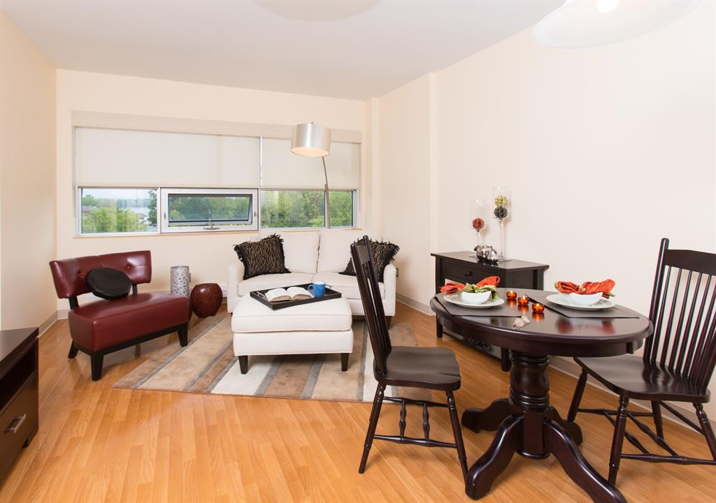 Living room set up with three chairs